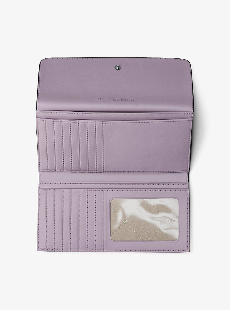 Carteira Michael Kors Jet Set Travel Signature Logo Tri-Fold Wallet, Lona com Logo Signature, cor Lilás, vista lateral | Original Exports
